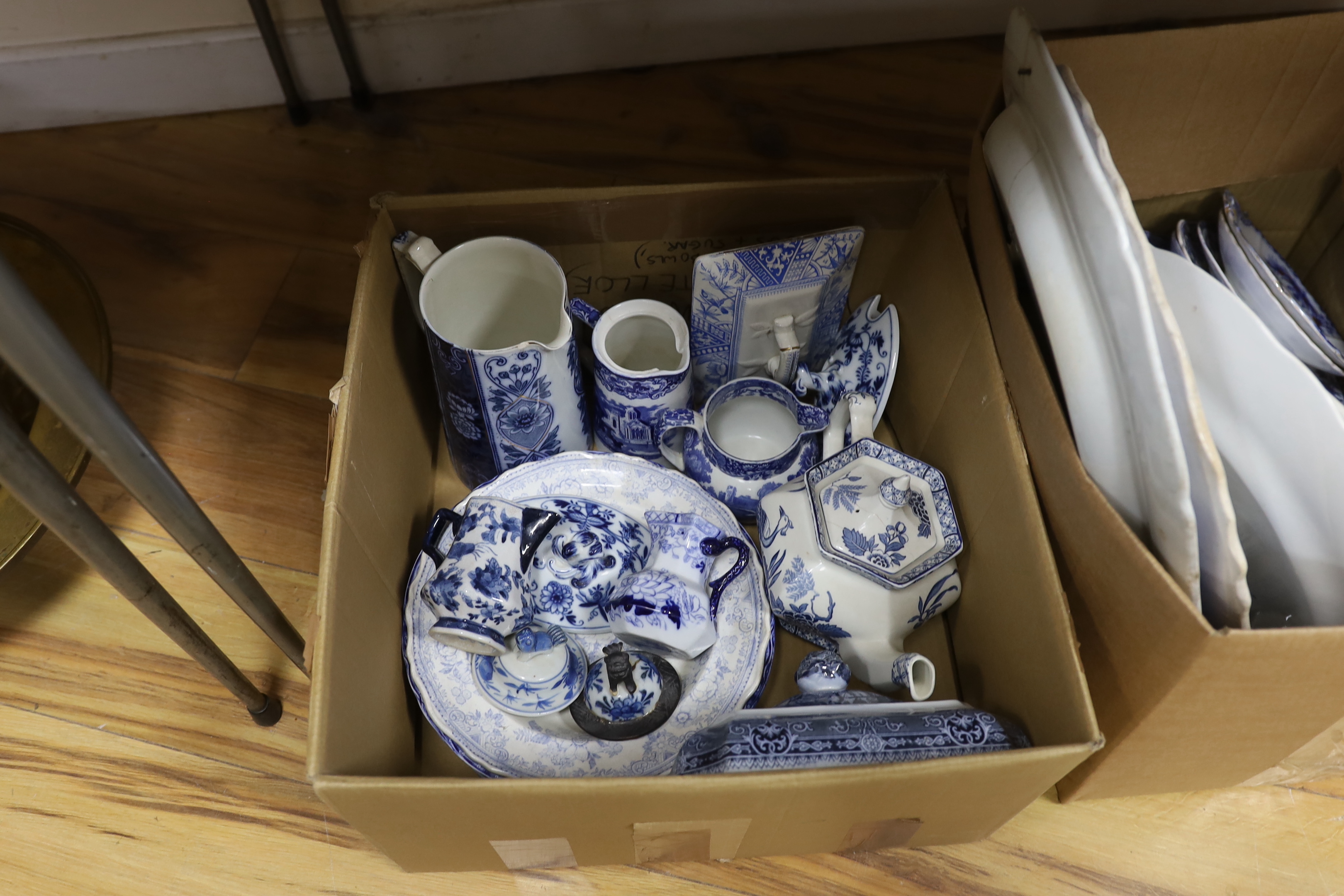 A collection of 19th / 20th century blue and white pottery including platters, tureens and jugs